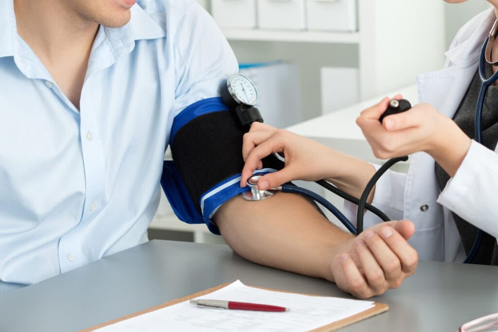 Dutch-dotcor-taking-blood-pressure-of-an-American-patient