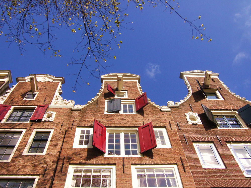 photo-of-dutch-houses-against-blue-sky