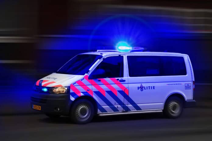 dutch-police-car-driving-at-night