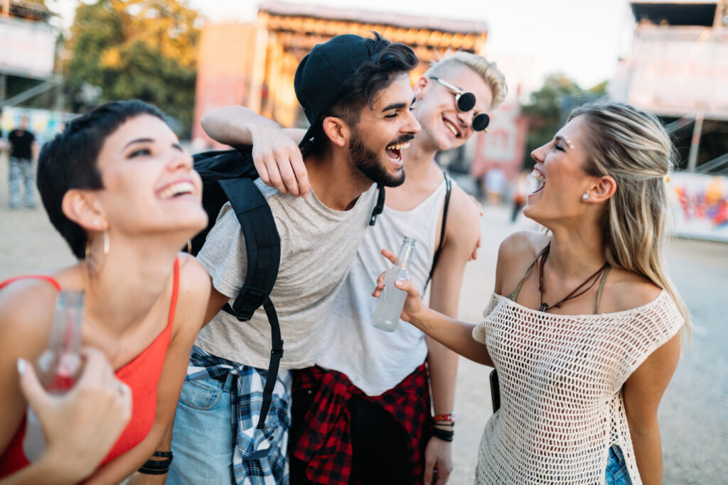 Group-of-friends-with-dutch-names-laughing-together-at-music-festival-in-the-netherlands