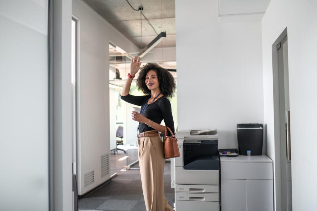 photo-of-woman-waving-goodbye-in-office-in-the-Netherlands