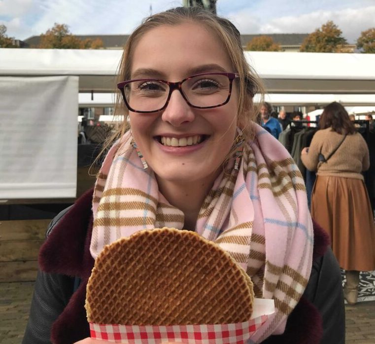 Photo-of-DutchReview-crew-smiling-with-a-stroopwafel-in-hand