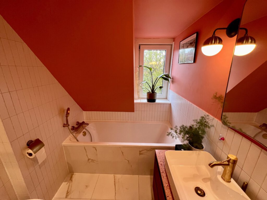 beautiful-newly-renovated-bathroom-bathtub-and-pink-wall