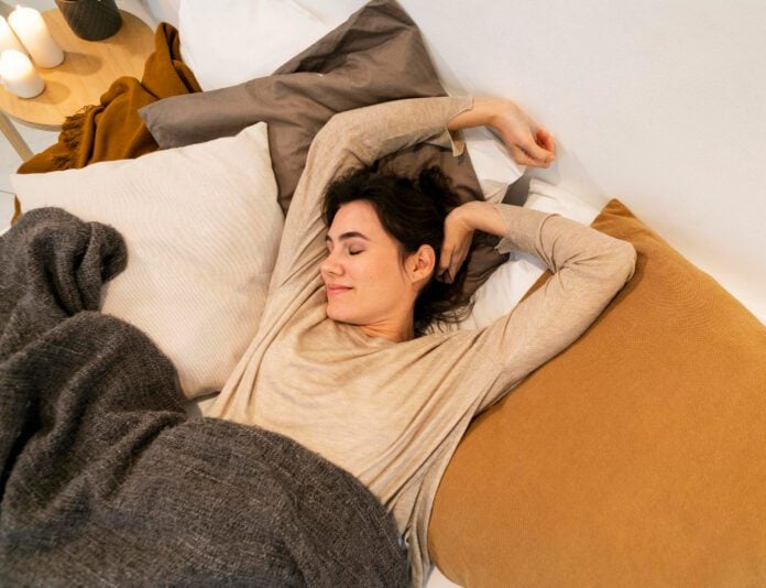 photo-of-woman-sleeping-on-comfortable-mattress-from-Emma-Sleep-in-the-Netherlands