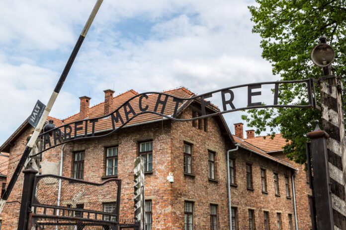 Entrance-gate-of-concentration-camp-Auschwitz-Birkenau-reads-arbeit-macht-frei