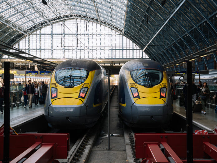 Two-yellow-and-blue-eurostar-trains-parked-at-St-Pancras-train-station-in-London