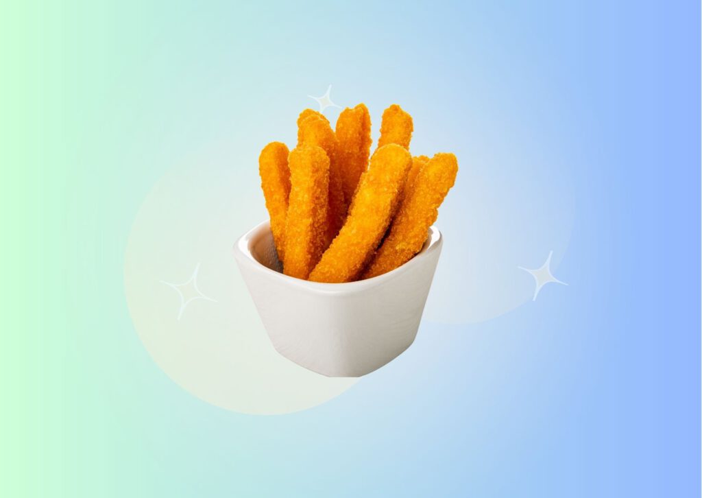 deep-fried-chicken-sticks-in-white-porcelain-bowl-against-gradient-light-blue-to-green-background