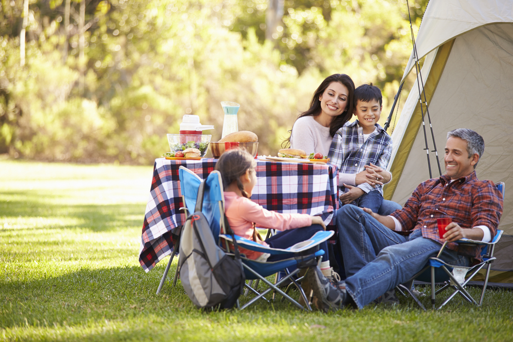 Family-sitting-at-campsite-in-fraince