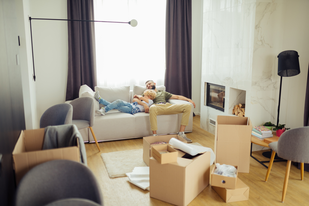 Photo-of-father-and-son-on-couch-in-their-new-home