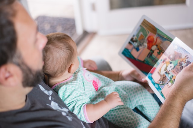 dutch-father-reading-to-baby