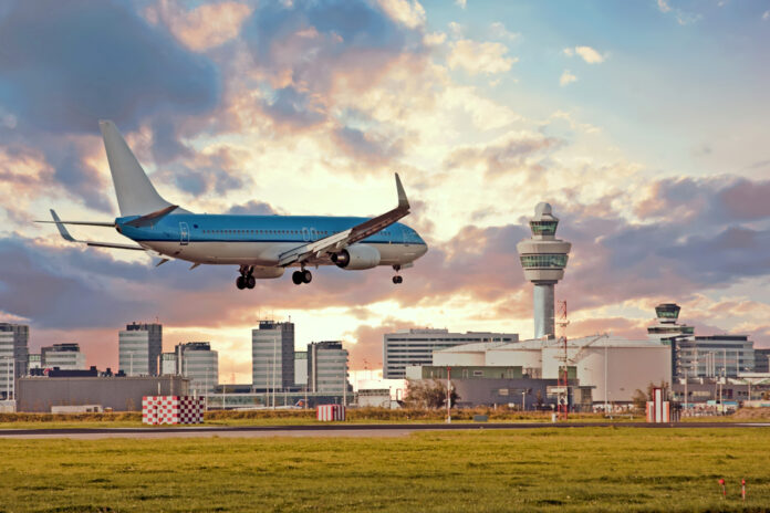 photo-of-plane-landing-in-Schiphol-after-plane-ticket-prices-increase