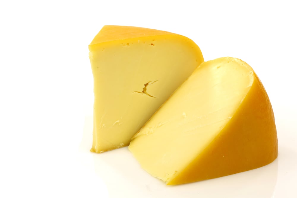 Gouda-cheese-from-the-netherlands-against-a-white-background