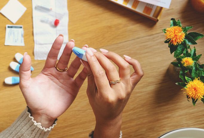 girl-pricking-her-finger-for-dutch-fertility-test