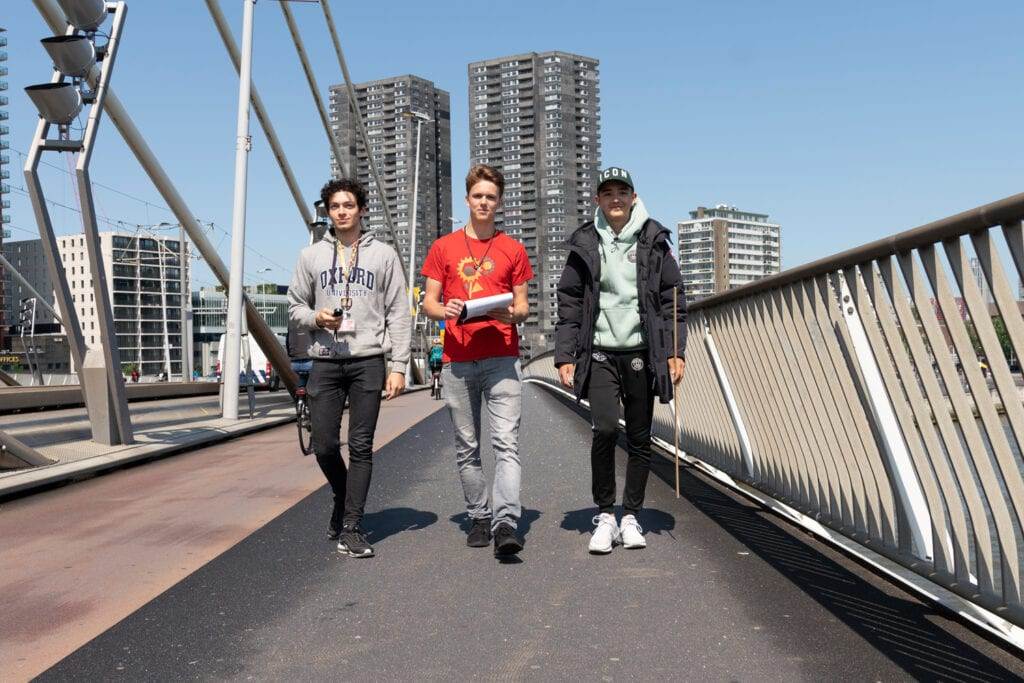 Photo-of-three-male-students-from-Rotterdam-International-Secondary-School-crossing-Erasmus-Bridge-Rotterdam