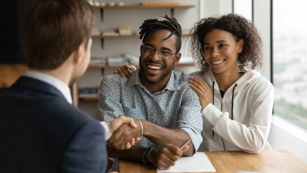 photo-of-couple-shaking-hands-with-mortgage-advisor-waiting-for-mortgage-offer-in-the-Netherlands-to-be-accepted