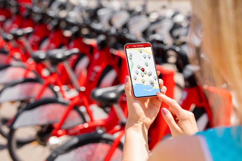 Woman-using-share-bike-app-to-rent-bicycle-in-Amsterdam