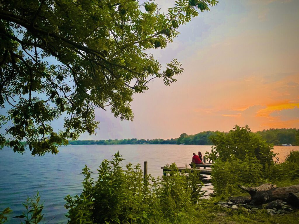 photo-of-Bright-orange-sunset-over-lake-with-trees-lakes-in-the-netherlands