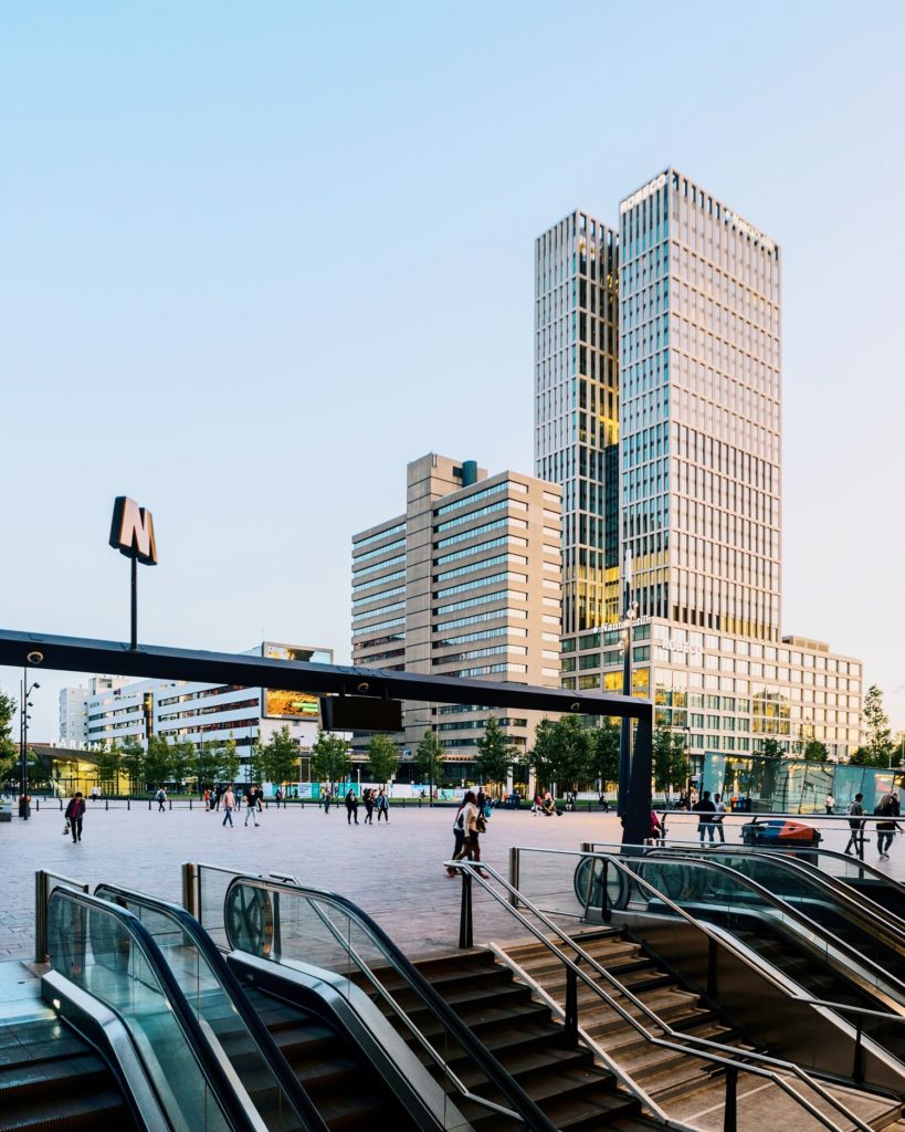 Photo-of-Rotterdam-central-station-stairs-and-escalators-leading-with-city-buildings-outside