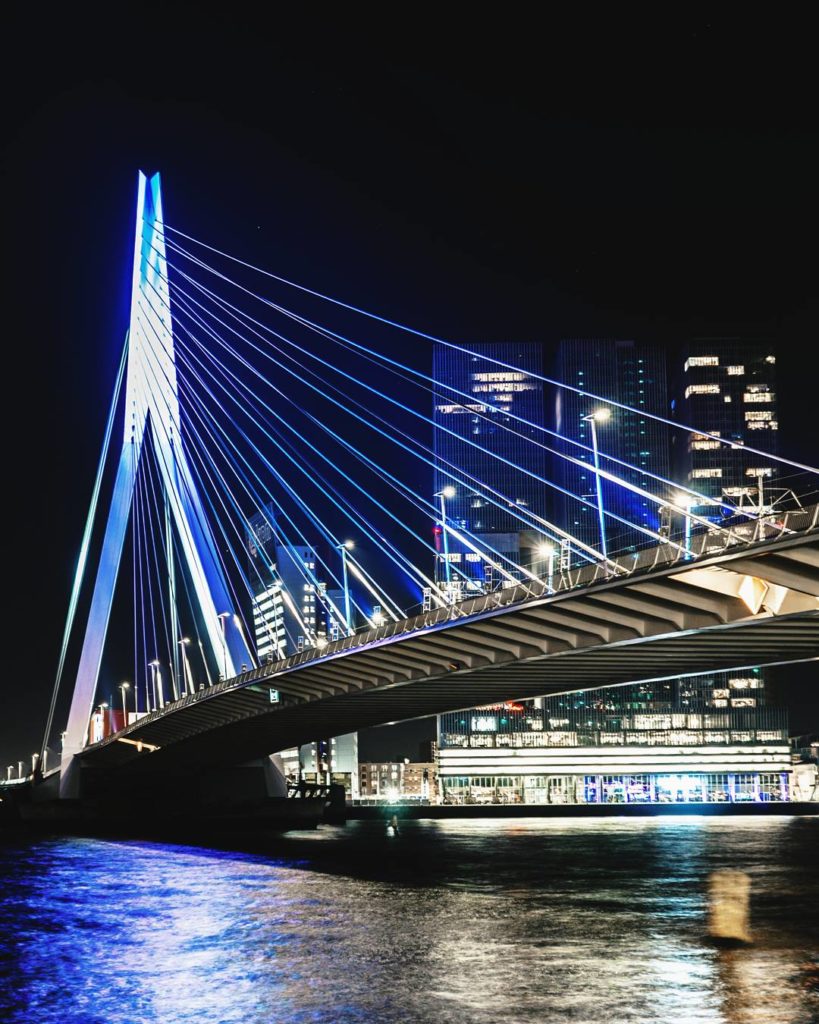 photo-of-Erasmus-Bridge-at-night-with-water-below-Rotterdam