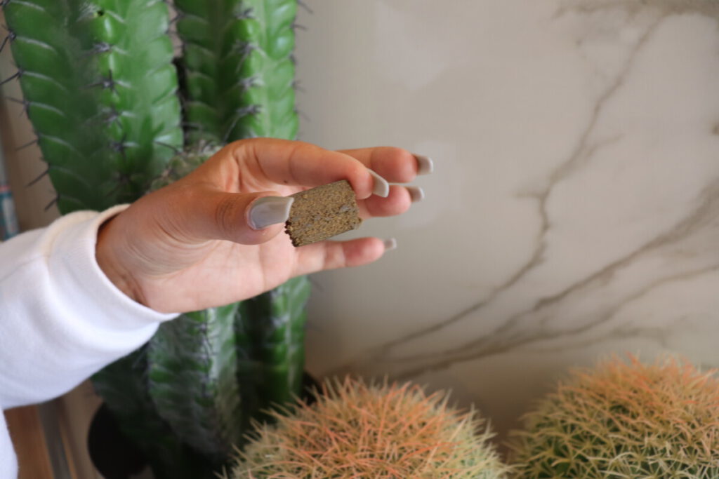 Photo-of-hand-holding-a-block-of-hash