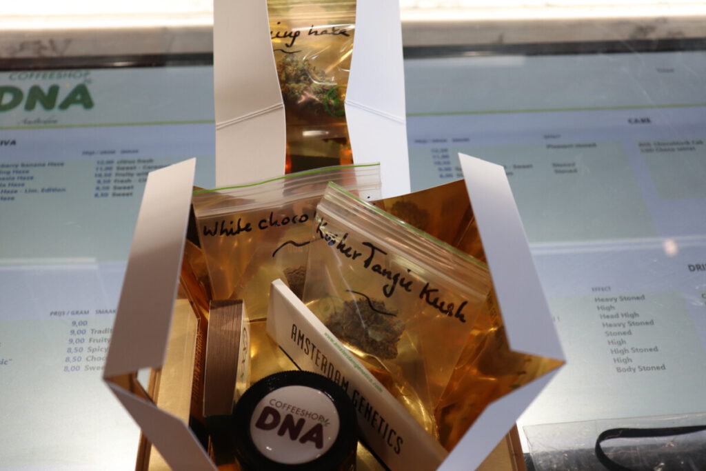 photo of gift box of weed, hash, grinder, and papers at DNA Coffeeshop Amsterdam