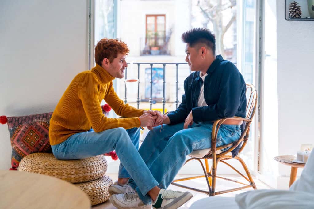 photo-of-couple-sitting-together-at-home-discussing-getting-a-mortgage-in-the-Netherlands