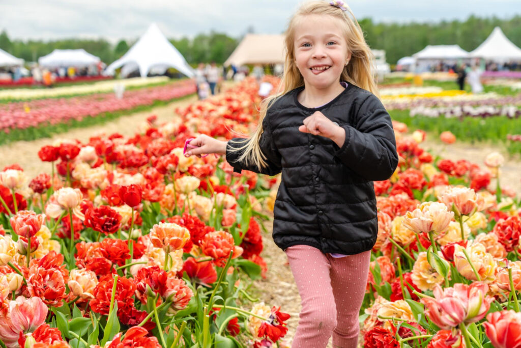 photo-of-child-running-through-tulip-field-in-the-Netherlands