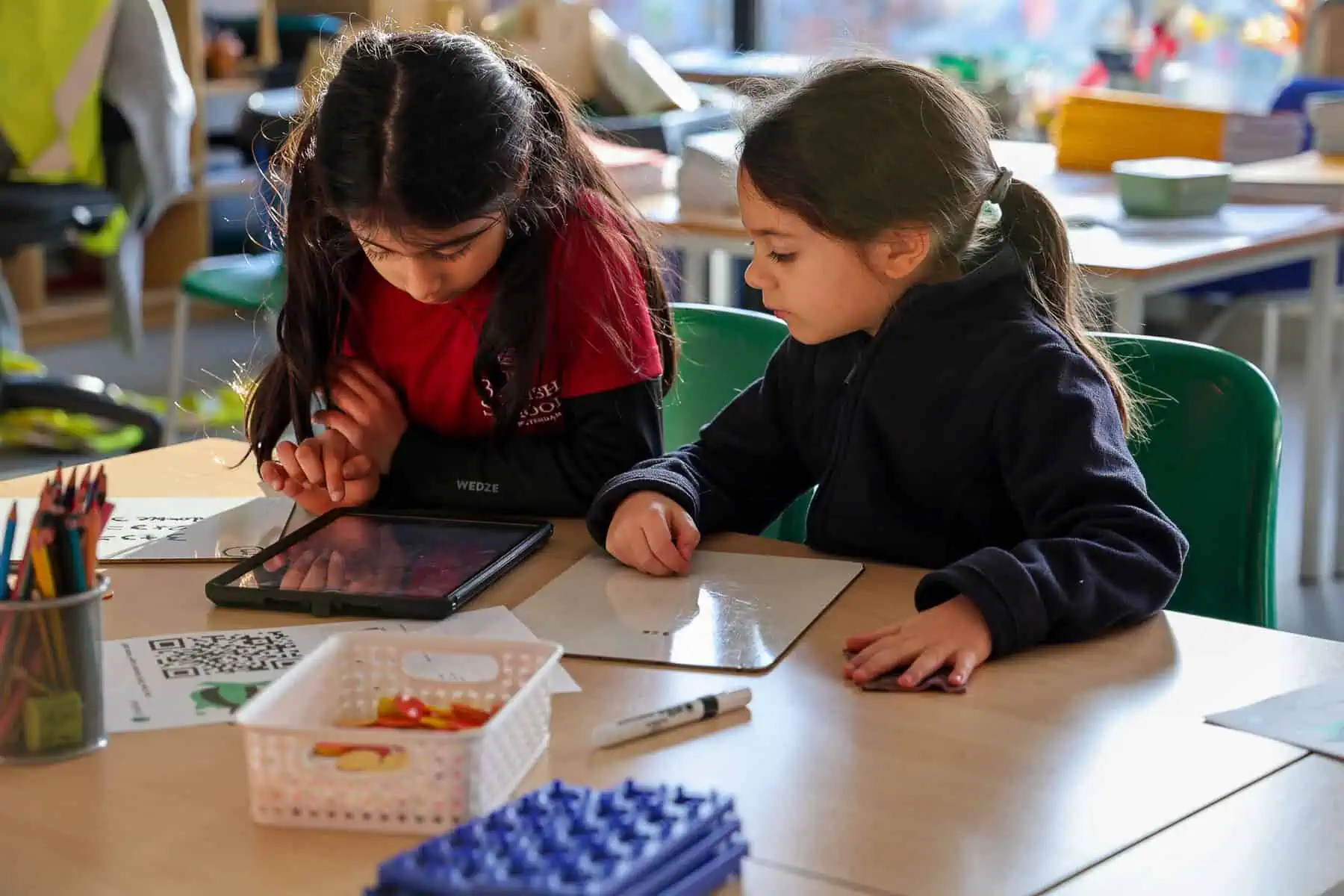 two-little-girls-at-the-british-school-of-amsterdam-solving-math-problems-in-class