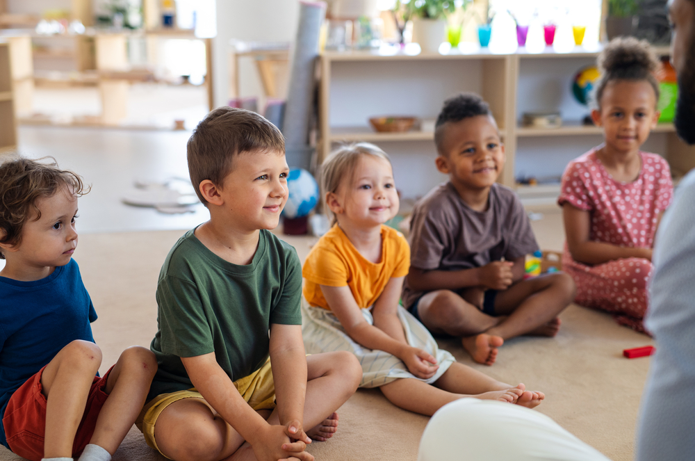 photo-of-children-at-a-cay-care-smiling-in-a-row