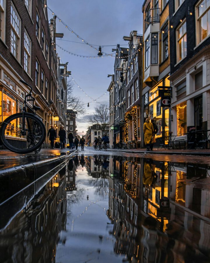 amsterdam-in-the-rain-reflected-in-puddle