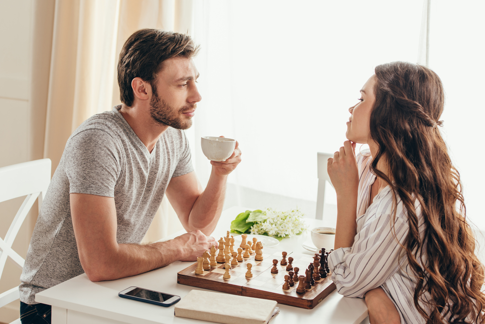 Man-and-woman-play-friendly-competition-of-chess