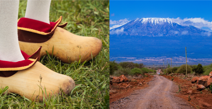 photo-of-pair-of-wooden-clogs-next-to-mount-kilimanjaro
