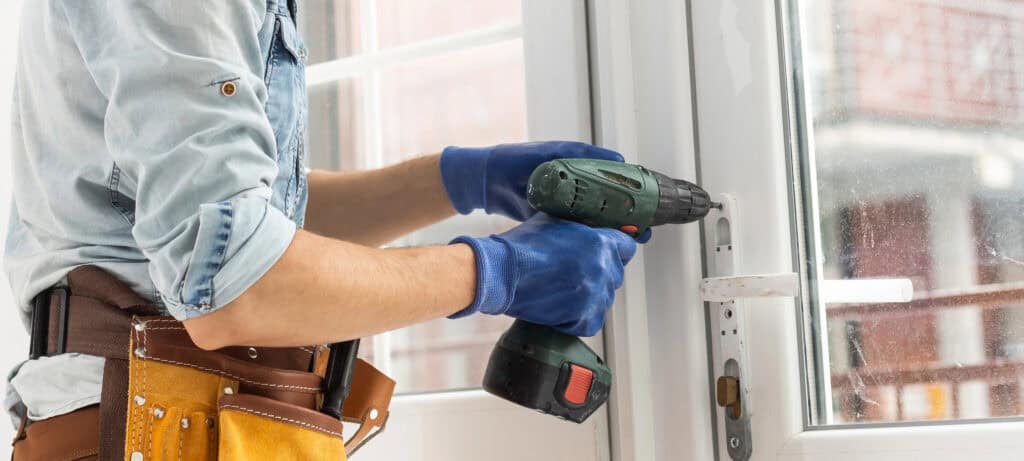man-drills-a-hole-using-a-drill-machine
