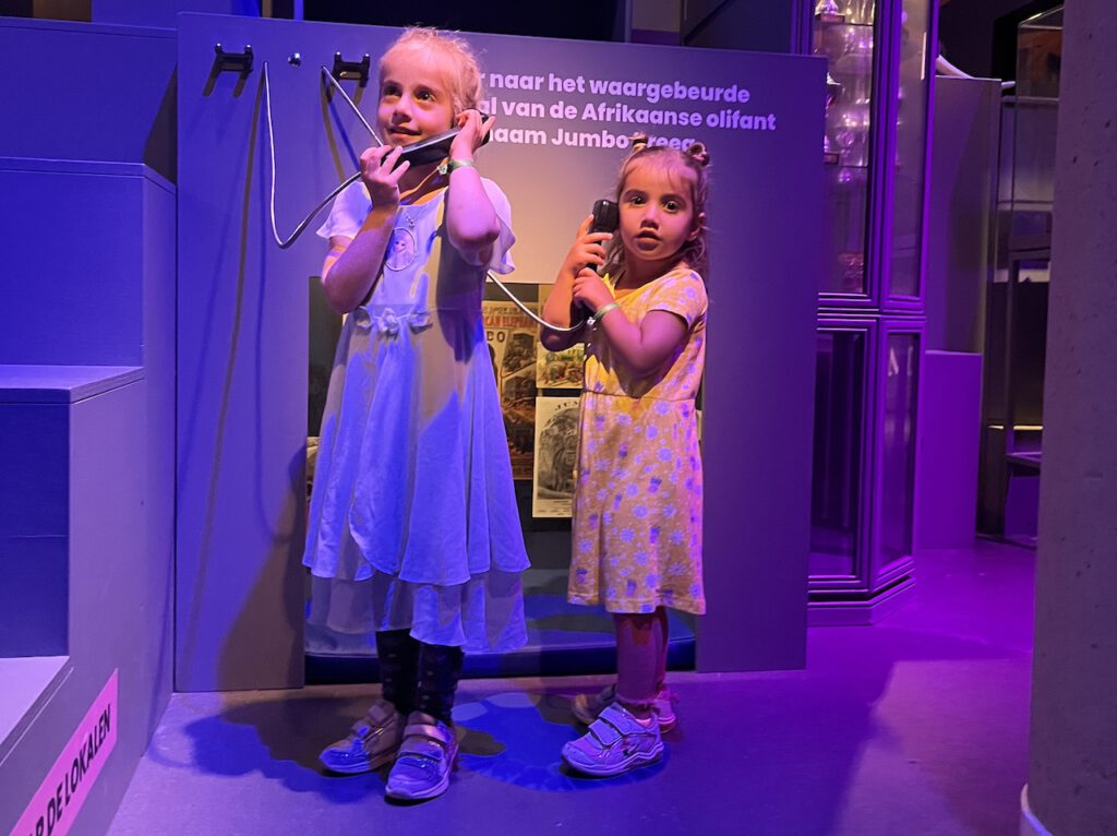 photo-of-children-on-phone-at-Museum-Volkenkunde-exhibit-having-fun