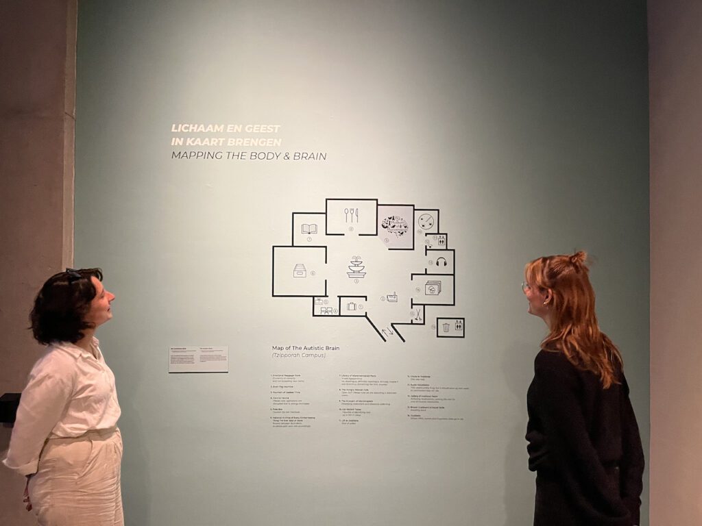 photo-of-two-women-looking-at-map-art-installation-at-Museum-Volkenkunde