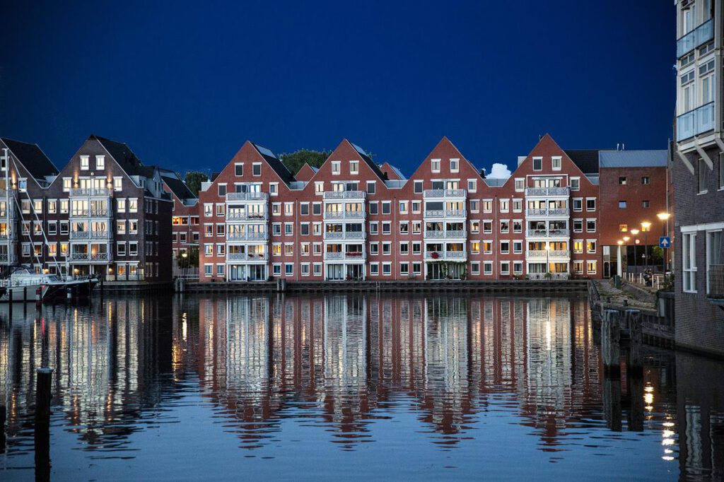 photo-of-buildings-in-Hoorn-reflected-over-a-large-body-of-water