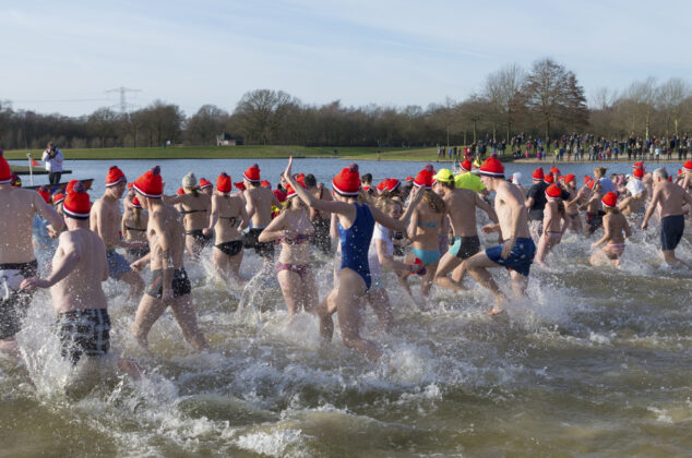 Tens of thousands plunge into icy-cold water to bring in the New Year