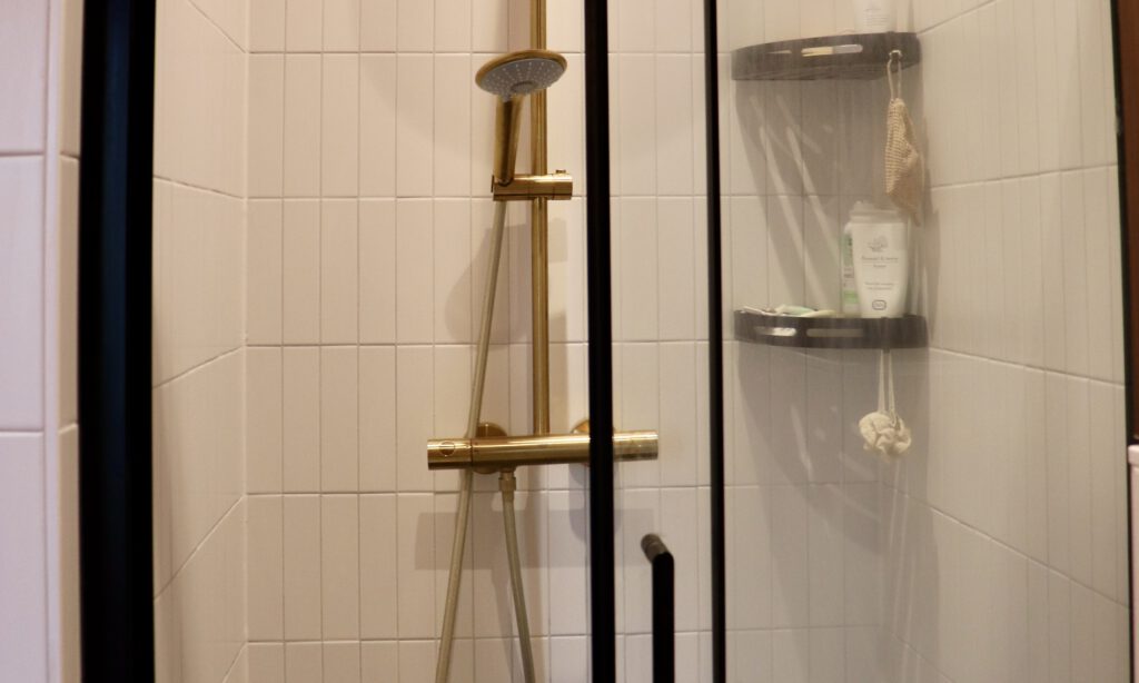 New_shower_in_renovated_bathroom_with_golden_details