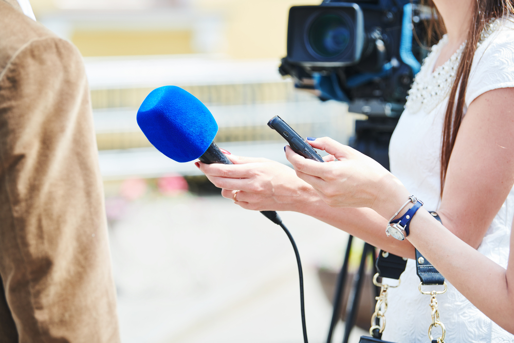 Interviewing-with-camera-and-microphone