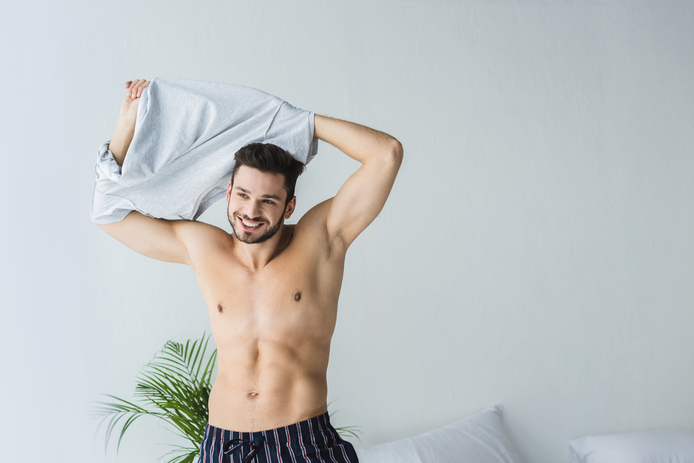 photo-of-man-taking-off-top-as-part-of-nudity-in-Netherlands