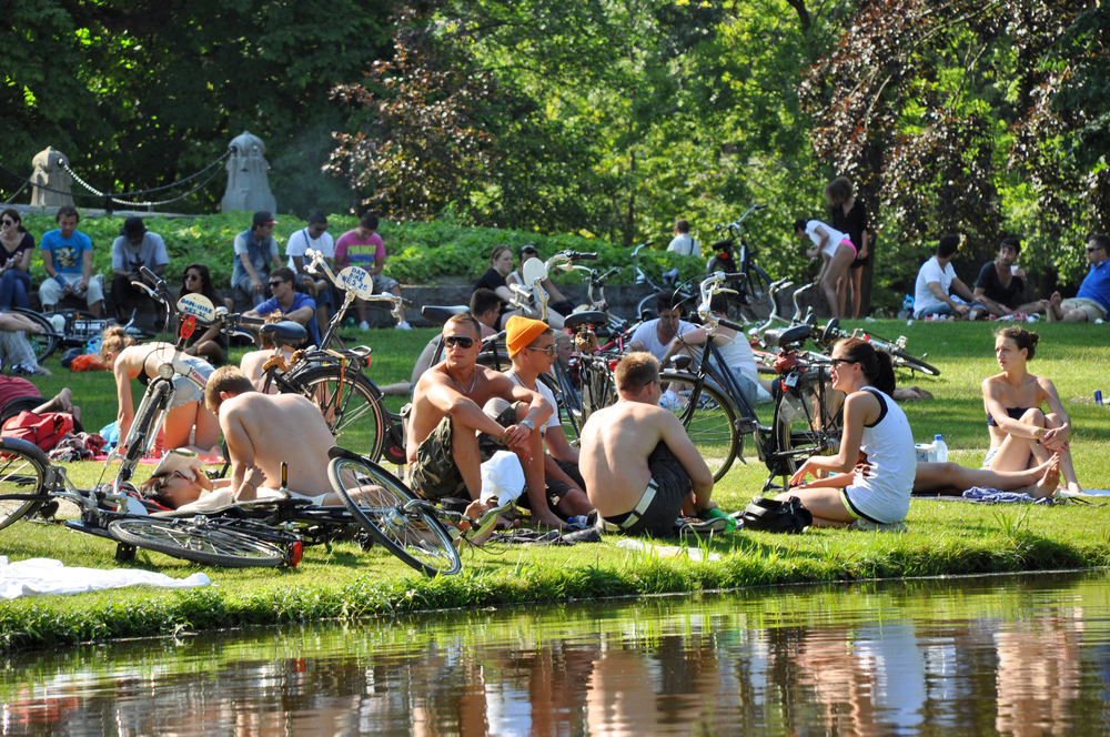 Students-chilling-in-the-park-with-bicycles-in-Amsterdam-on-a-sunny-day