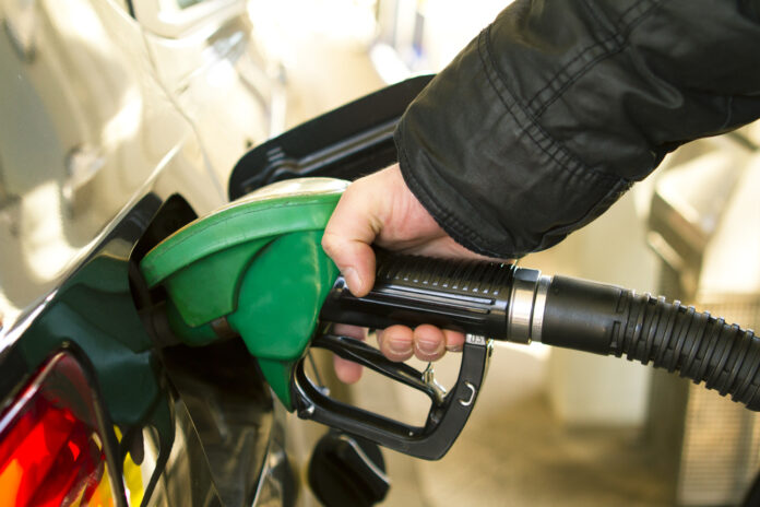 photo-of-a-man-filling-up-his-car-with-petrol