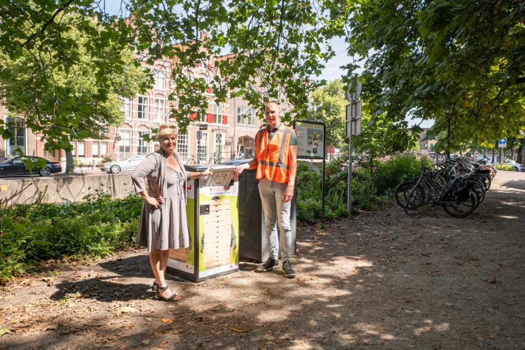 Politician-and-bin-man-in-front-of-new-pizza-bins