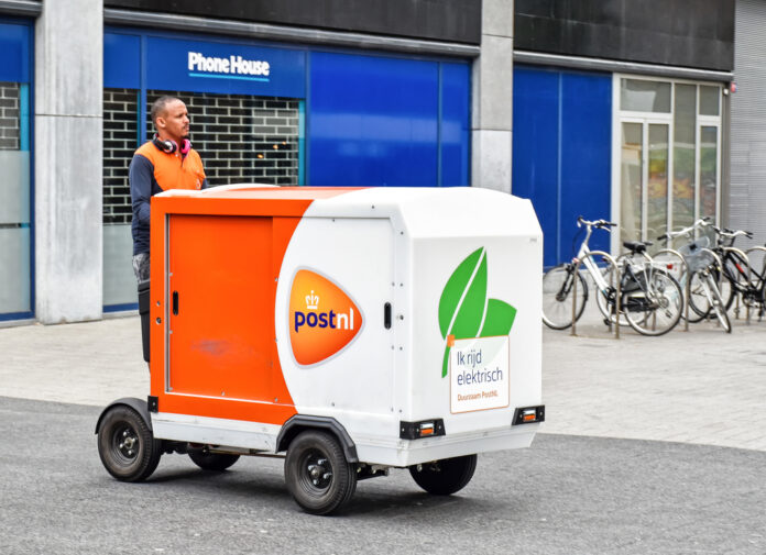photo-of-a-PostNL-driver-delivering-packages