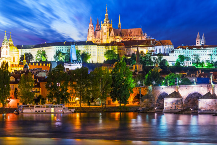 photo-of-Prague-lit-up-by-lots-of-bright-lights-along-the-water