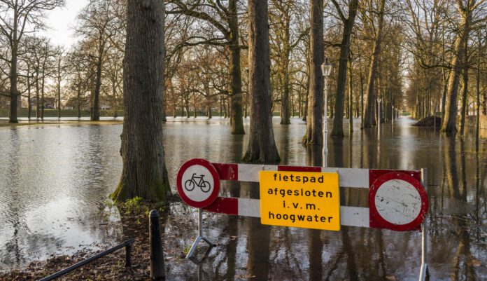 photo-of-flooding-in-Netherlands-with-warning-sign
