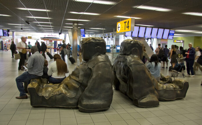 Photo-of-people-waiting-gate-terminal-Schihol-airport
