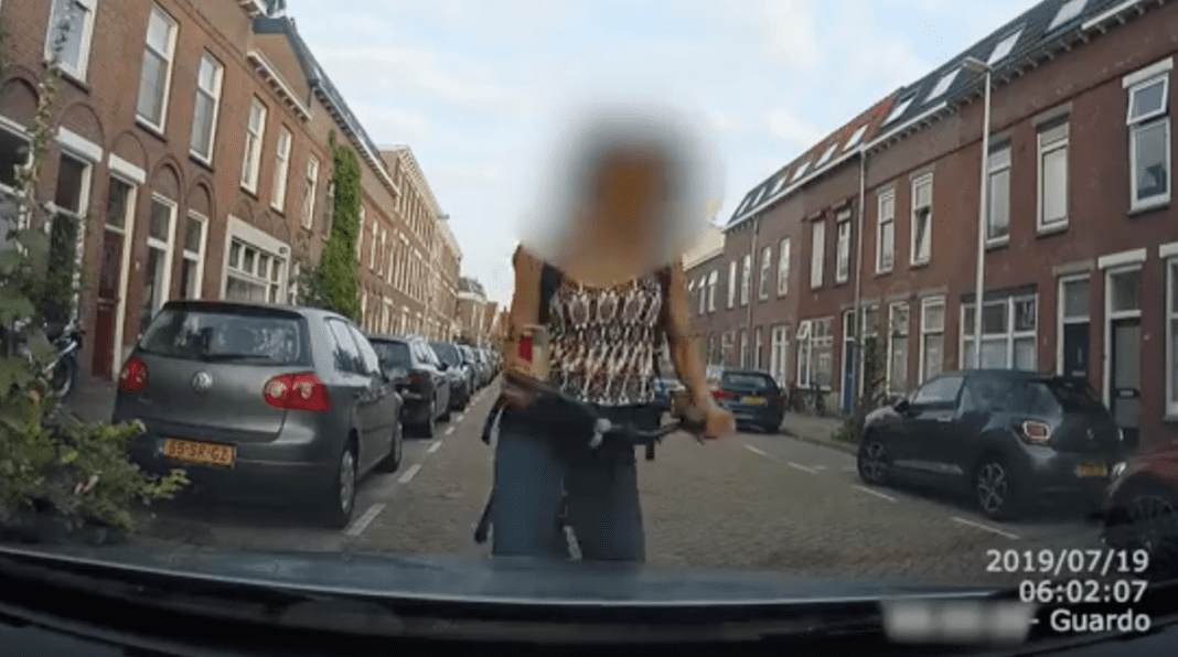 Cyclist crashes into parked car while on smartphone