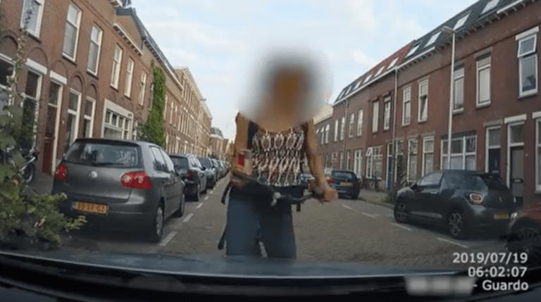 HIT & CYCLE: Texting Cyclist Crashes Into Parked Car in Dutch Neighbourhood