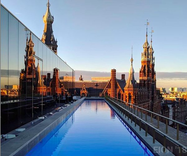 photo-of-rooftops-of-amsterdam-by-sunset-from-swimming-pool-in-W-Amsterdam